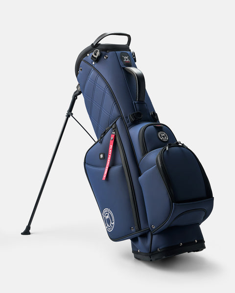 GHOSTGOLF Anyday Patriot golf bag in navy, standing on its integrated leg stand
