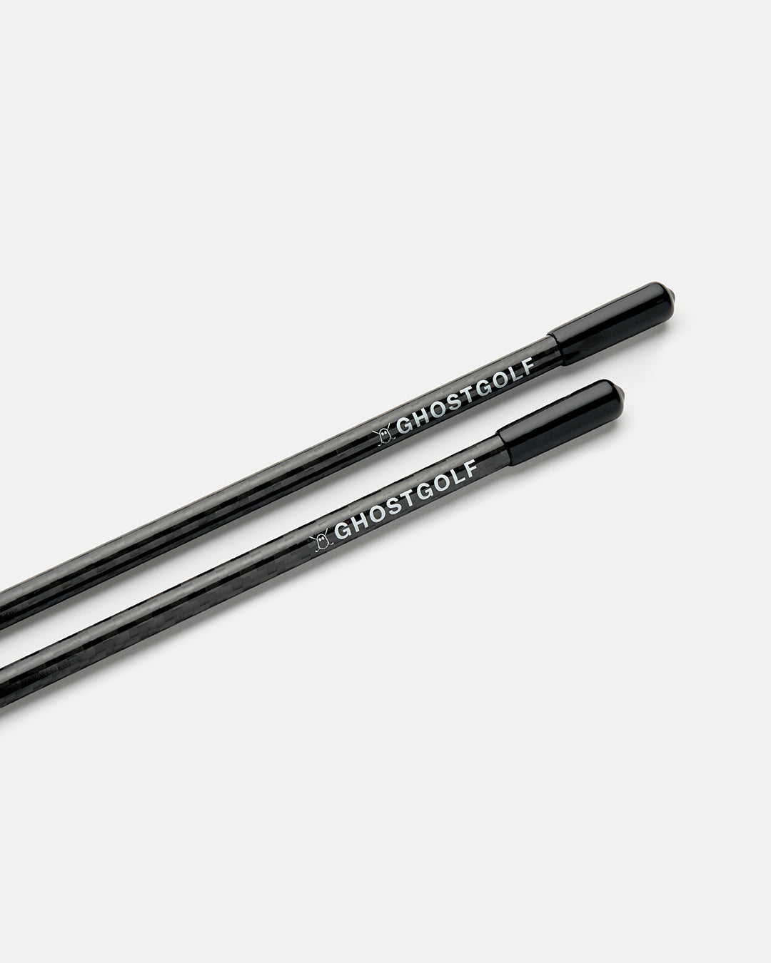 Closeup Product Shot of Black Alignment Stick with Ghost Golf Logo at the end of the Alignment Stick #color_black
