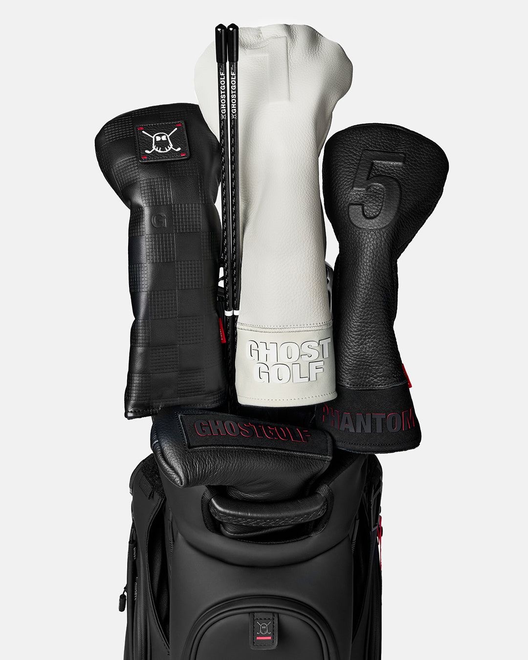 Front view of a Black Golf Alignment Stick stored in a golf bag beside several golf club head covers
#color_black