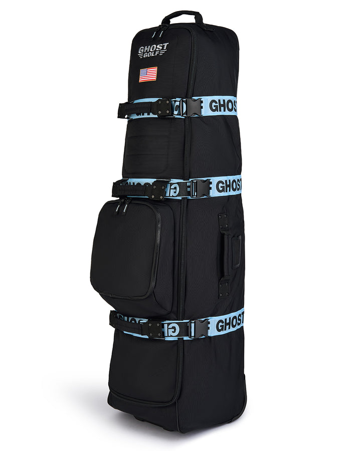 Three-quarter view of the Striker Secondary AWOL Travel Bag showcasing Ghost Golf embroidery across the top panel and an embroidered USA flag detail. Angled product image highlighting the bag’s premium construction, travel-ready design, patriotic accents, and signature Ghost Golf craftsmanship. #color_black