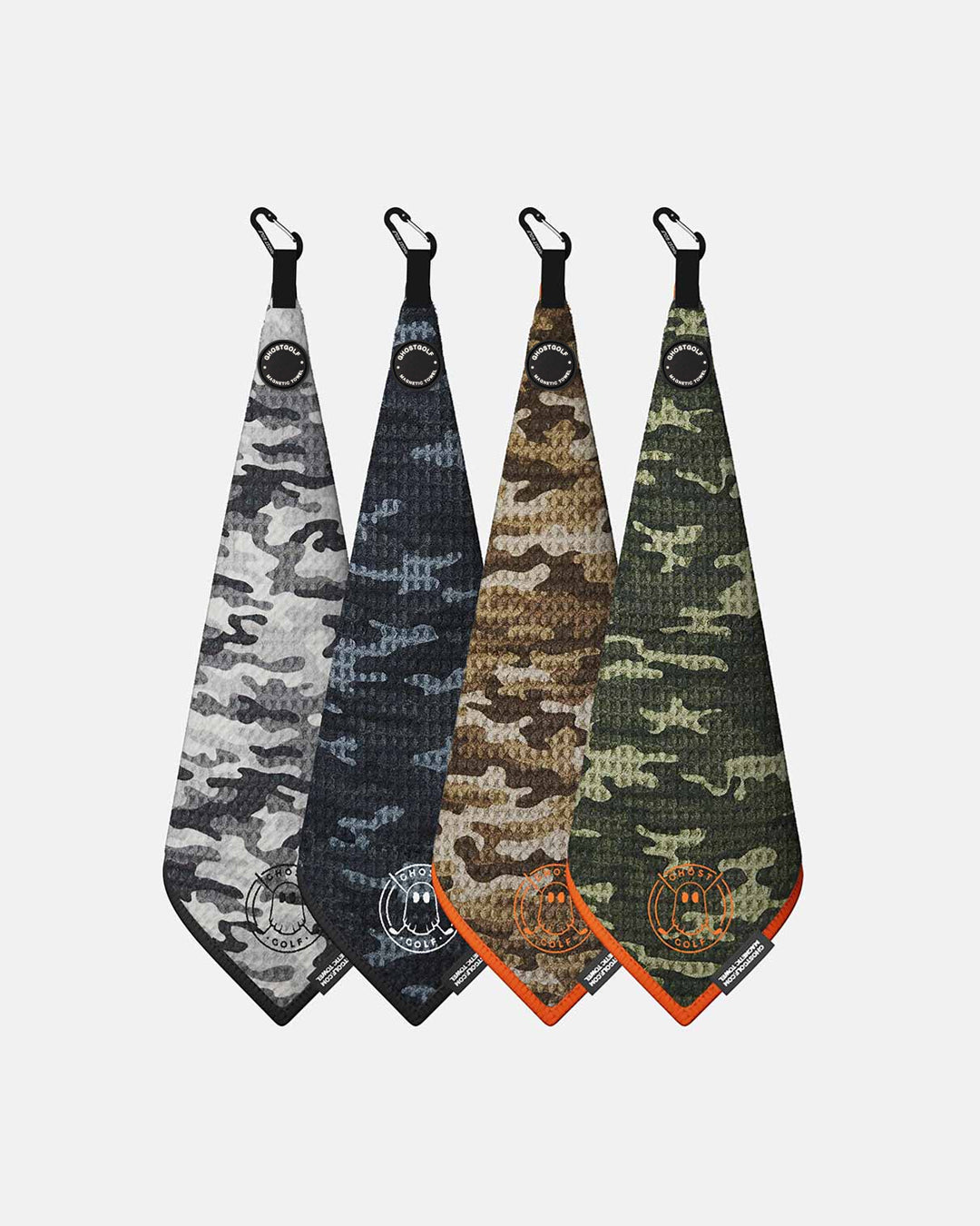 Product shot of 4 Pack Camo Ghost Golf Magnetic Greenside Towel with emblem logo near the bottom and carabiner clip at the top in snow camo black camo forest camo and desert camo