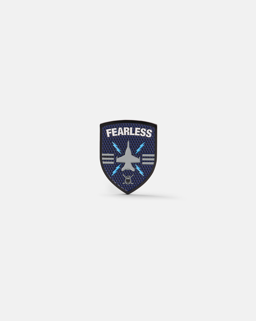 Product photo of a shield-shaped ball marker featuring the word “Fearless,” a jet icon, and the Ghost Golf logo at the bottom.