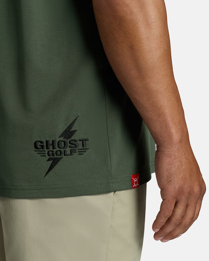 Closeup Shot of Forest Shadow Flight Tee showcasing front graphic Ghost Golf Hit on bottom right tee #color_forest-shadow