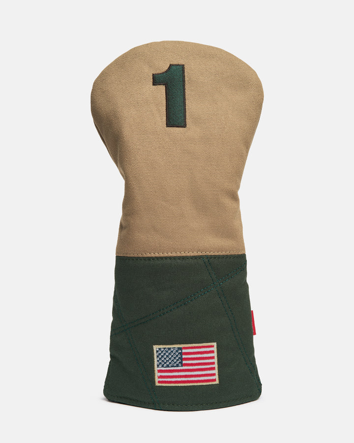 Front product shot of the G-Suit Tertiary Driver Head Cover featuring an embroidered number "1" at the top and an embroidered USA flag at the bottom. Clean front-facing image highlighting the premium materials, patriotic detailing, and signature Ghost Golf craftsmanship inspired by military aviation design. #size_driver
