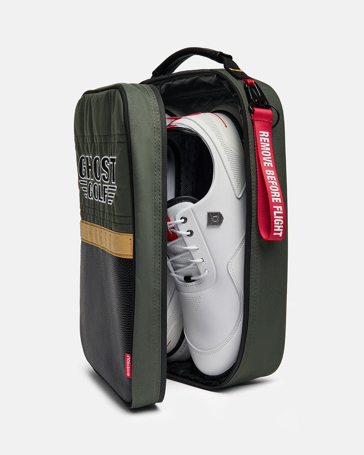 Three-quarter view of the G-Suit Shoe Bag with shoes stored inside, showcasing the spacious main compartment and functional storage design. Angled product image highlighting the bag's capacity, premium construction, and Ghost Golf branding.