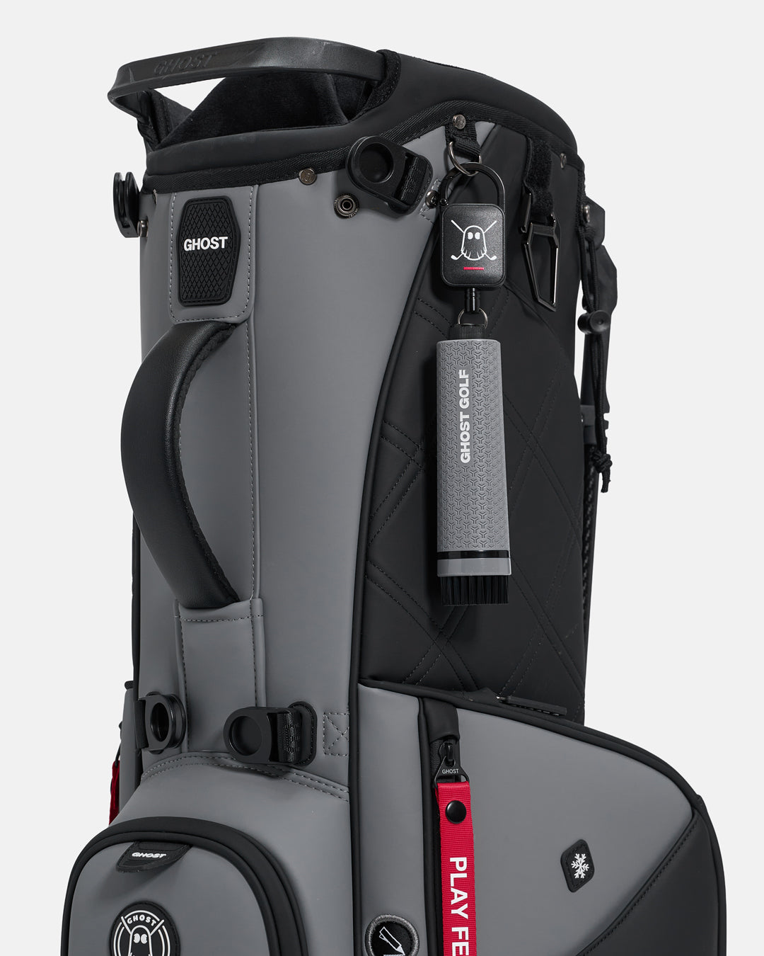 Grey Ghost Golf club and shoe cleaning brush with a magnetic back, water container, and removable brush heads attached to a golf bag  #color_grey