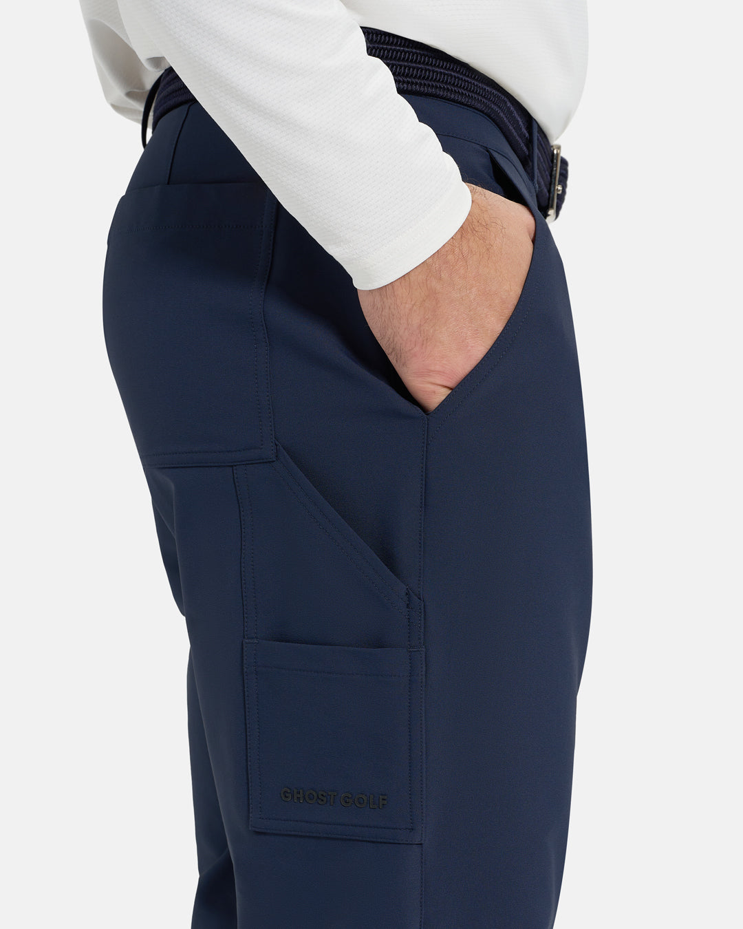 Closeup Side View of Navy Ghost Golf Core Jogger Pant on White Male Model with hand in pocket #color_navy