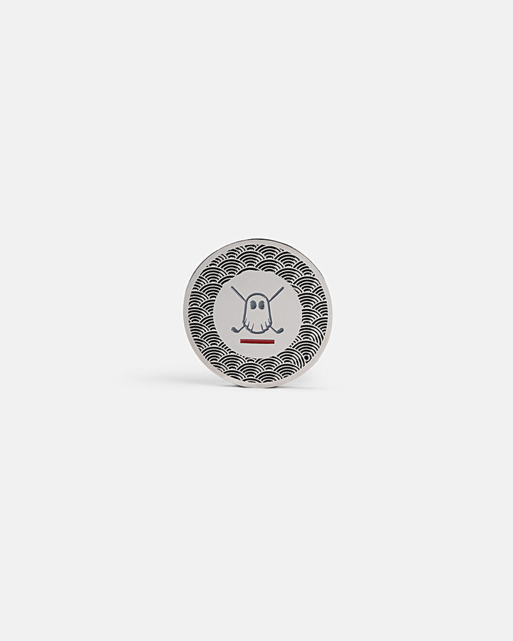 Product photo of a circular silver ball marker featuring the Ghost Golf icon in the center with Japanese-inspired half-circle wave patterns.