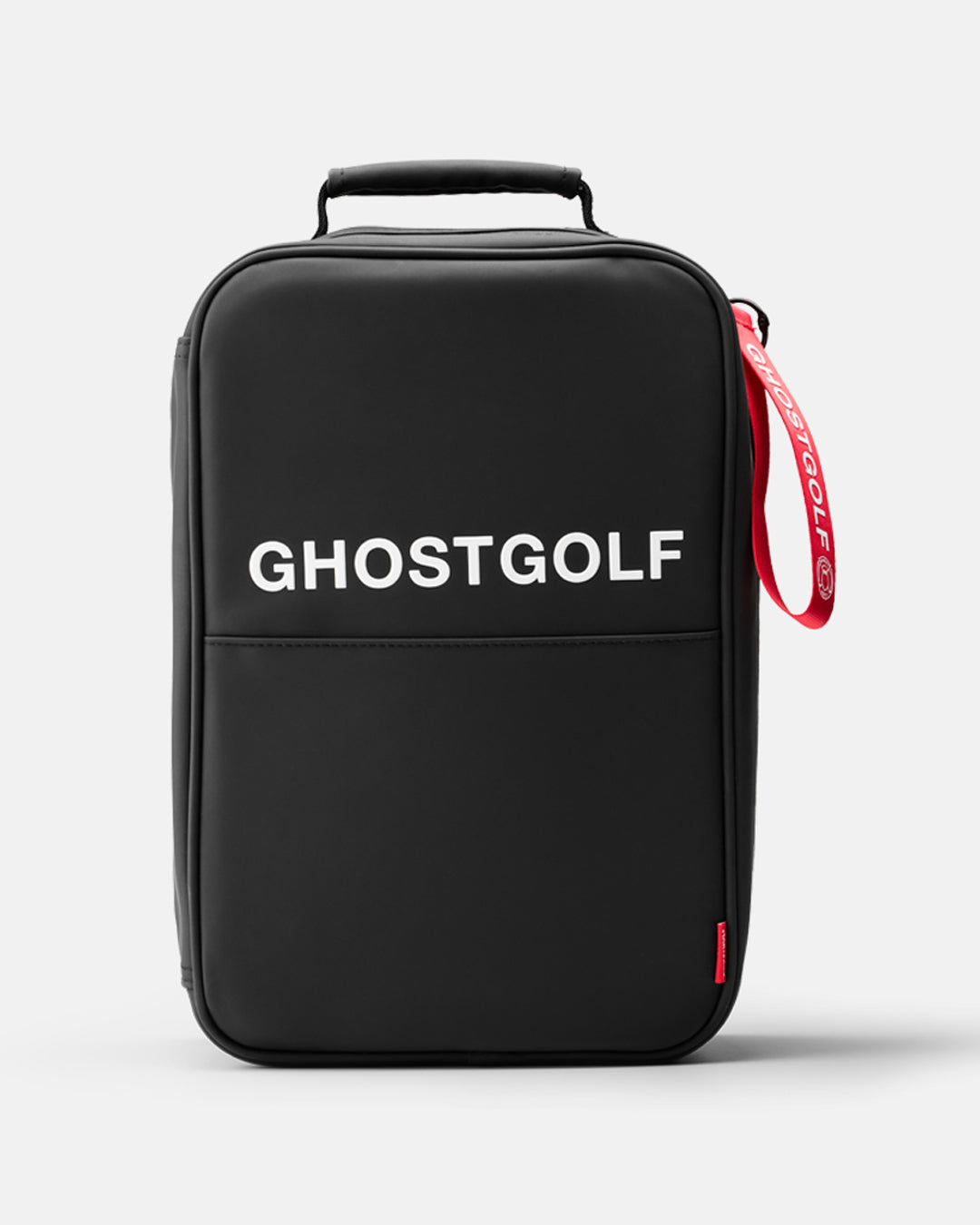 A black Ghostgolf shoe bag with a top handle, featuring the brand name 'GHOSTGOLF' in white text on the front and a red carrying strap, set against a light gray background.