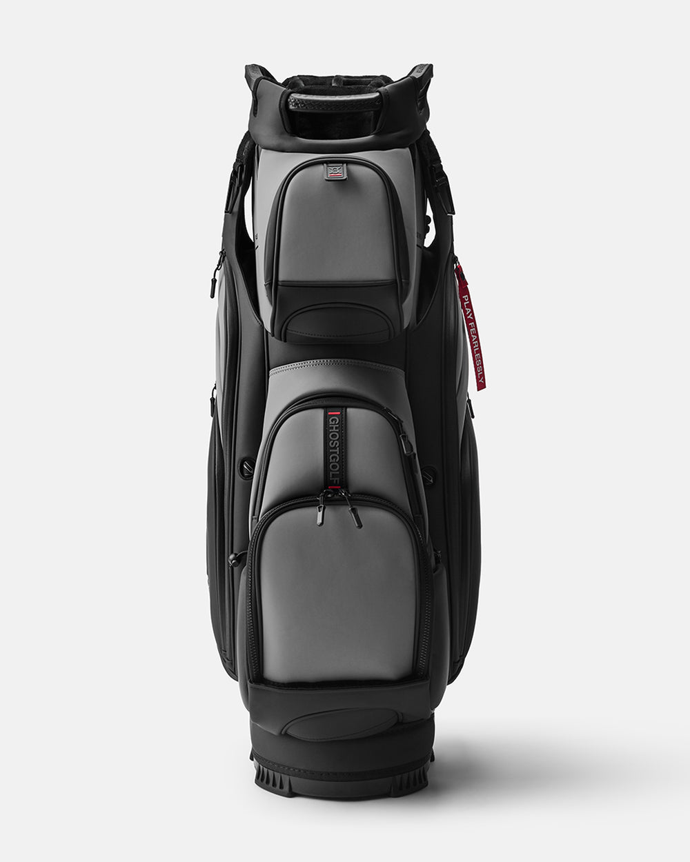 GHOSTGOLF GT-14 KOvert Ops golf bag in black and grey, shown at a front angle with zippered pockets, an embossed Ghost Golf logo, and a red “Play Fearlessly” tag.