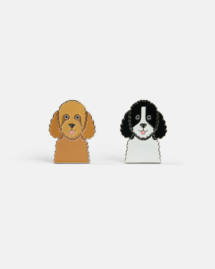 Product photo featuring two dog-shaped ball markers, including a Goldendoodle and a Bernedoodle design.