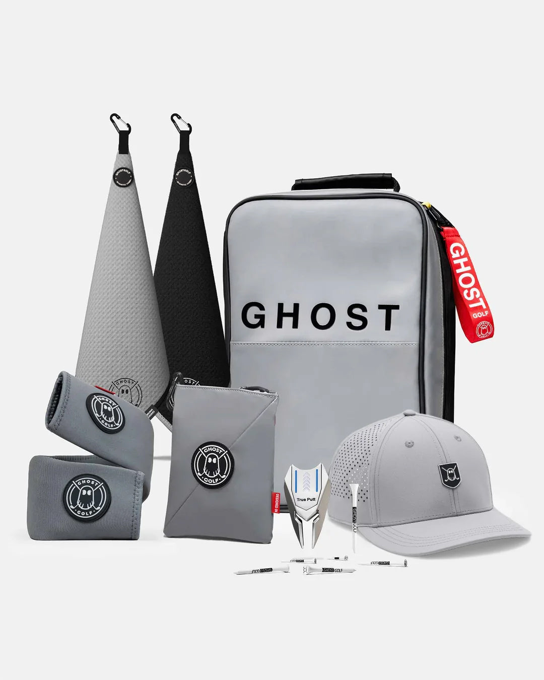 Product Shot of Maverick Bundle showcasing 2 greenside magnetic towels, utility pouch, cart strap sleeve, golf hat, divot tool, and golf tees