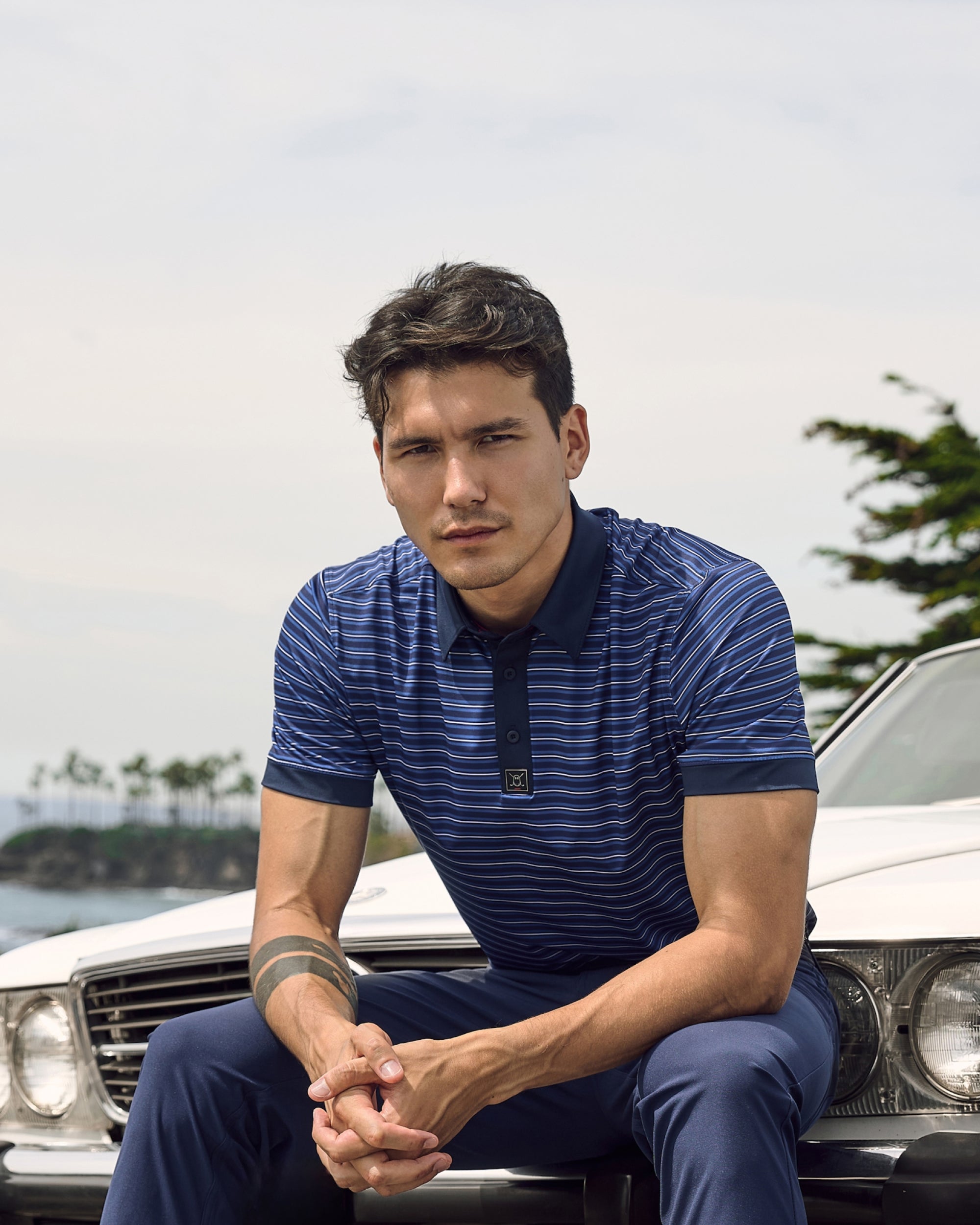 Mobile_Polo_Collection_Banner_Footer_Male Model wearing Navy Lined Shirt