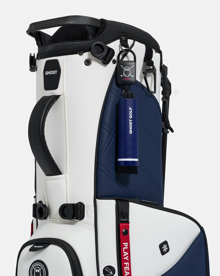 Navy Ghost Golf club and shoe cleaning brush with a magnetic back, water container, and removable brush heads attached to a golf bag  #color_navy