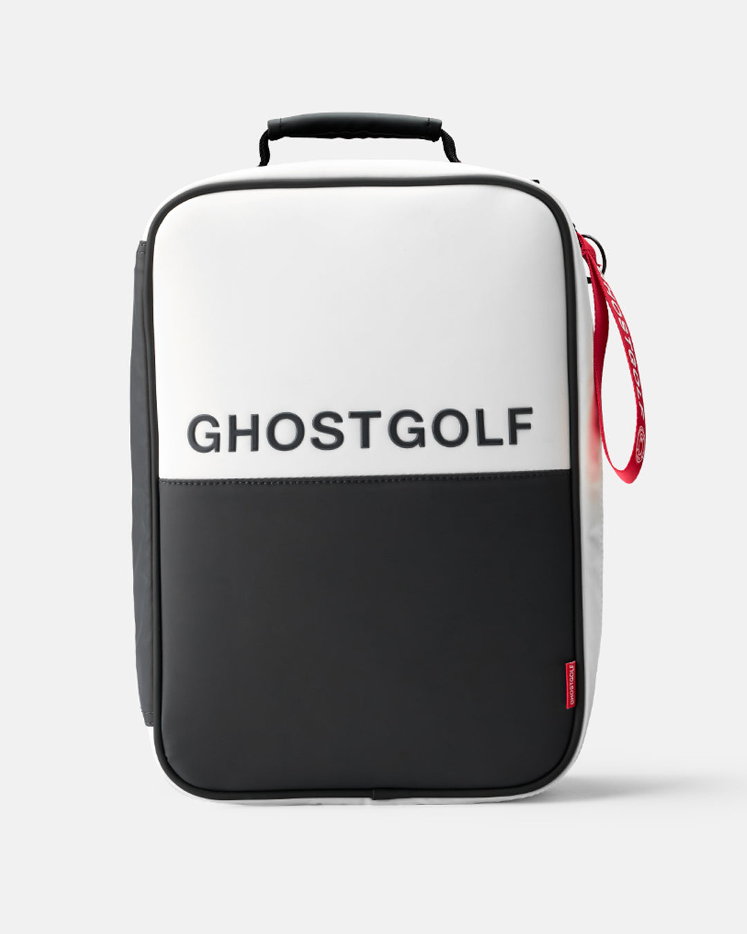 A Ghostgolf Shoe Bag with a color-blocked design featuring a white top half and black bottom half, with the brand name 'GHOSTGOLF' printed in black on the white section. It has a black top handle and a red zipper pull.
