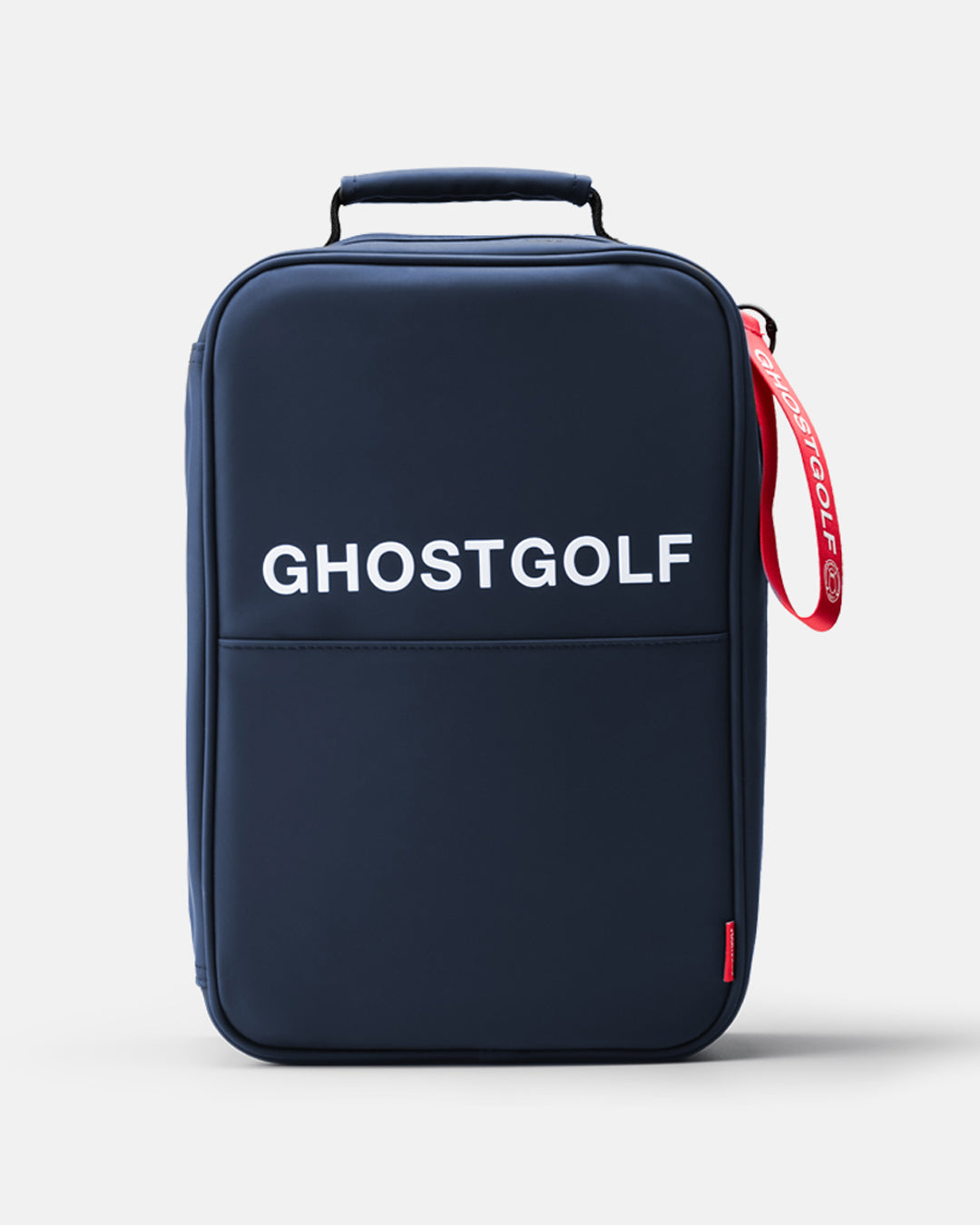 A  navy blue Ghostgolf shoe bag with white 'GHOSTGOLF' branding on the front, featuring a top handle, a red-and-white branded wrist strap, and a small red tag near the bottom right, set against a light gray background.