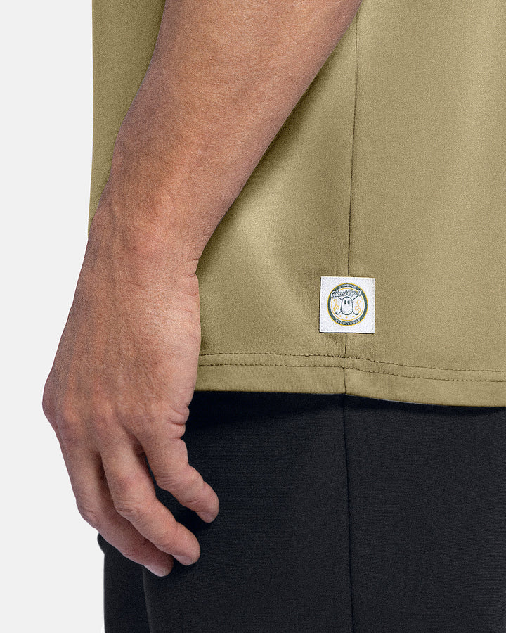 Closeup Side View of Sand Patrons Club Badge Tee on white male model showing ghost golf graphic hit #color_sand
