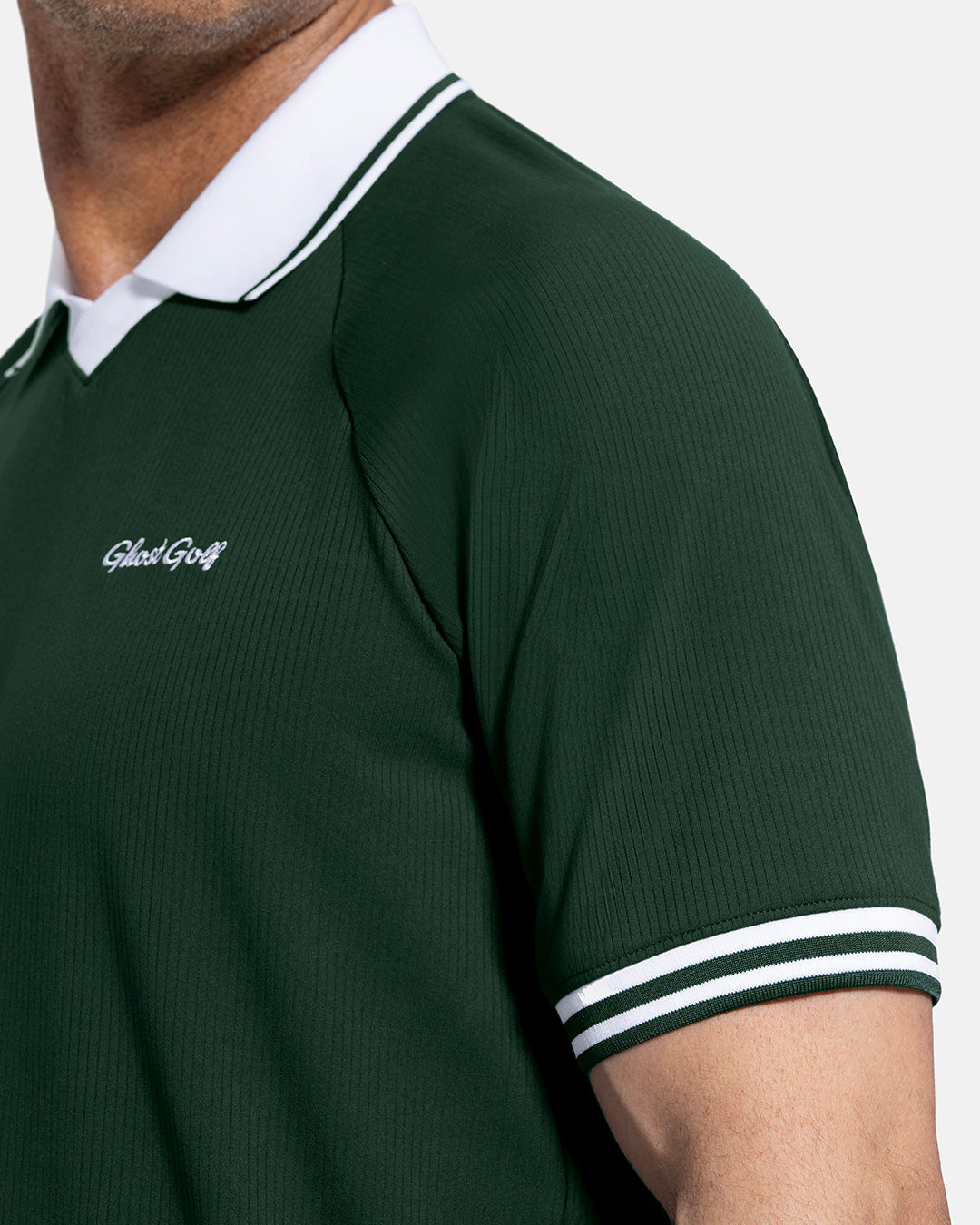 Closeup Side View of Bogey Green Patrons Heritage Polo on white male model showing ghost golf graphic hit #color_bogey-green