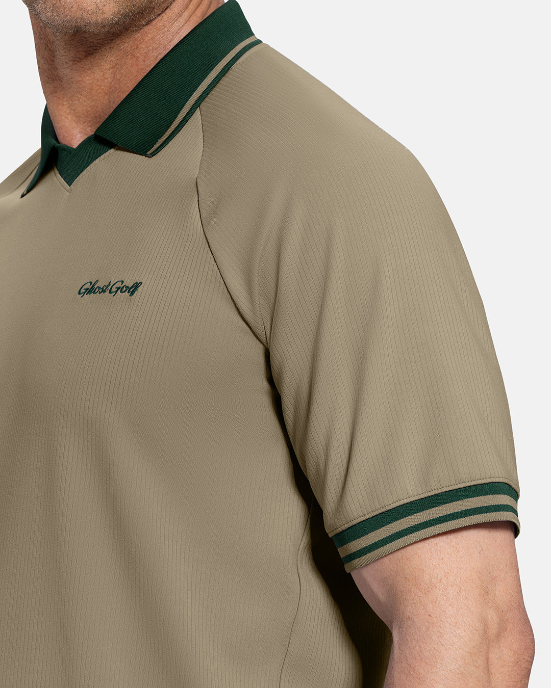 Closeup Side View of Sand Patrons Heritage Polo on white male model showing ghost golf graphic hit #color_sand-wedge
