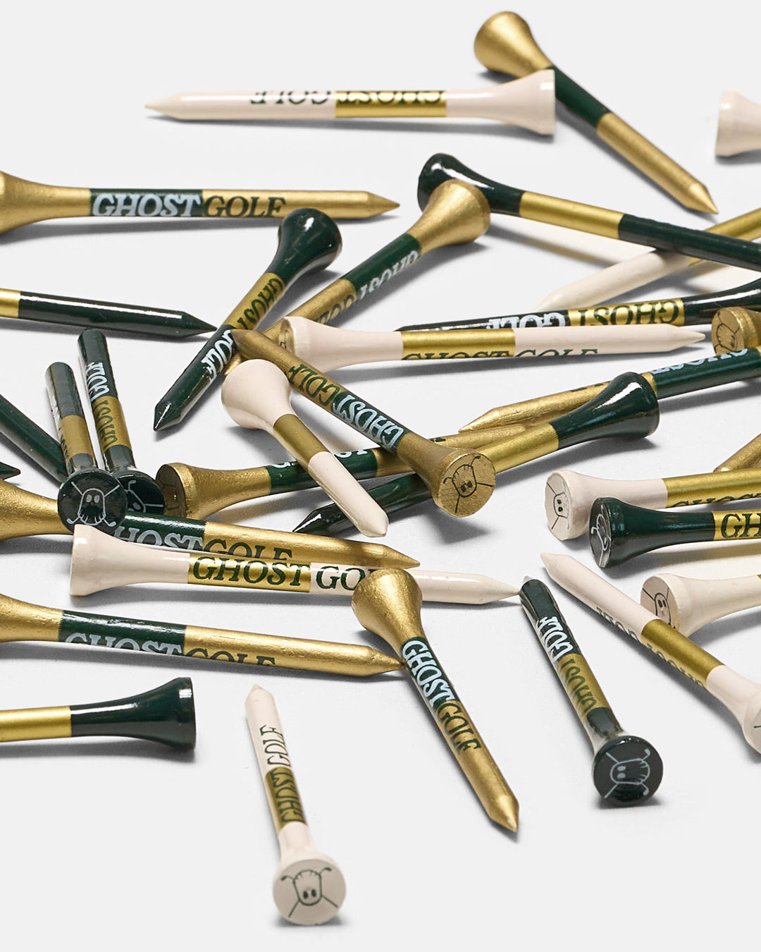 Product Shot of Patrons Only golf tees in white background. In green gold and white colors