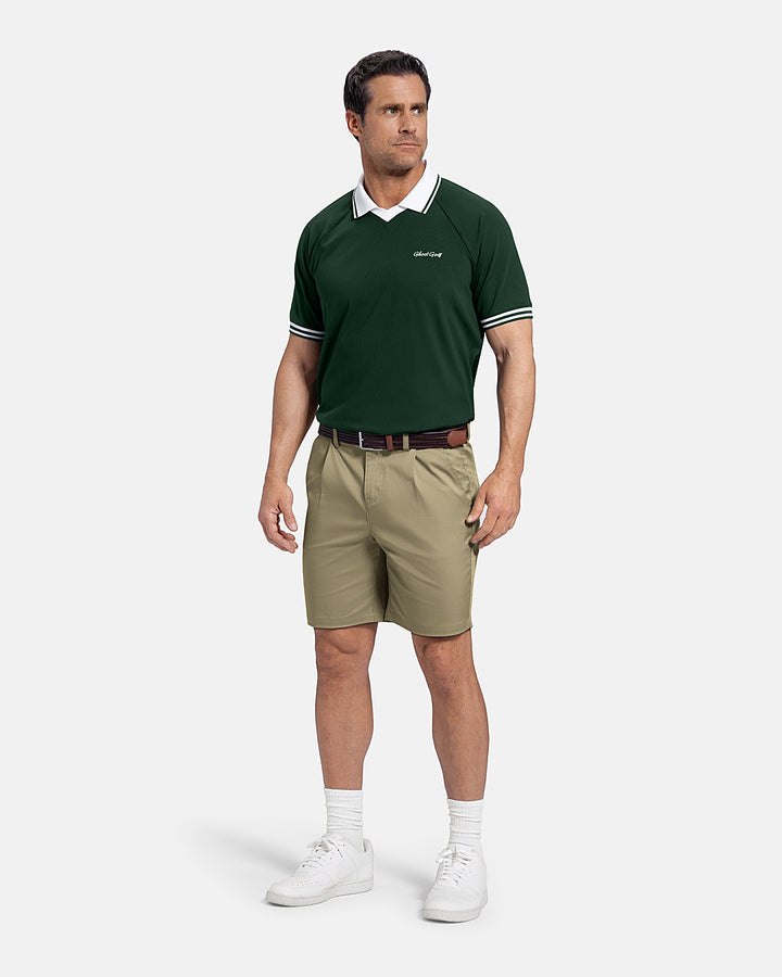 Full Front Back View of Sand Patrons Pleated Short on white male model wearing green polo white shoes #color_sand