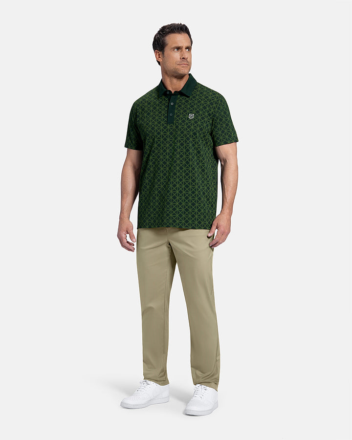 Full Body Front View of Bogey Green Patrons Printed Polo on white male model wearing beige pants and white shoes #color_bogey-green