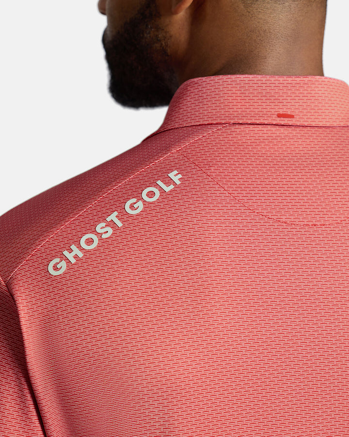 Closeup Back Shoulder Shot of Red Qualifier Grid Polo back of the polo showcasing ghost golf hit on left back shoulder #color_red
