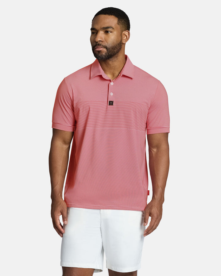 Top Front Body Shot of Black Male Model Wearing Red Qualifier Stripe Polo with white shorts. Polo is untucked #color_red