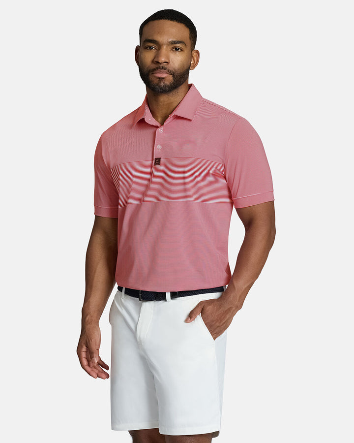 Top Front Body Shot of Black Male Model Wearing Red Qualifier Stripe Polo with white shorts and black belt. Polo is tucked #color_red