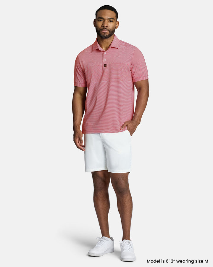 Full Front Body Shot of Black Male Model Wearing Red Qualifier Stripe Polo with white shorts and white shoes #color_red