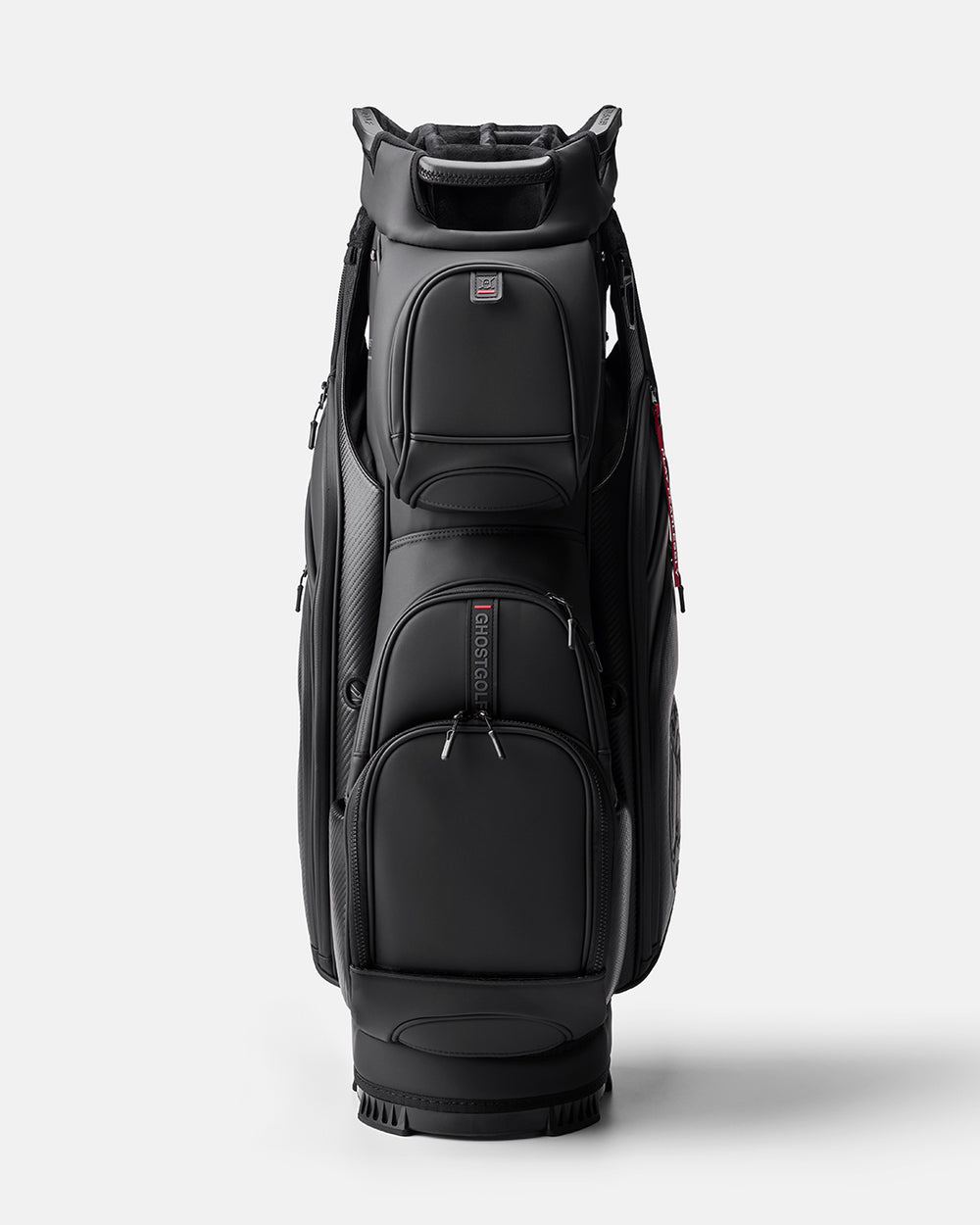 GHOSTGOLF GT-14 Ronin golf bag in black and carbon fiber accents, shown at a front angle with zippered pockets, an embossed Ghost Golf logo, and a red “Play Fearlessly” tag.