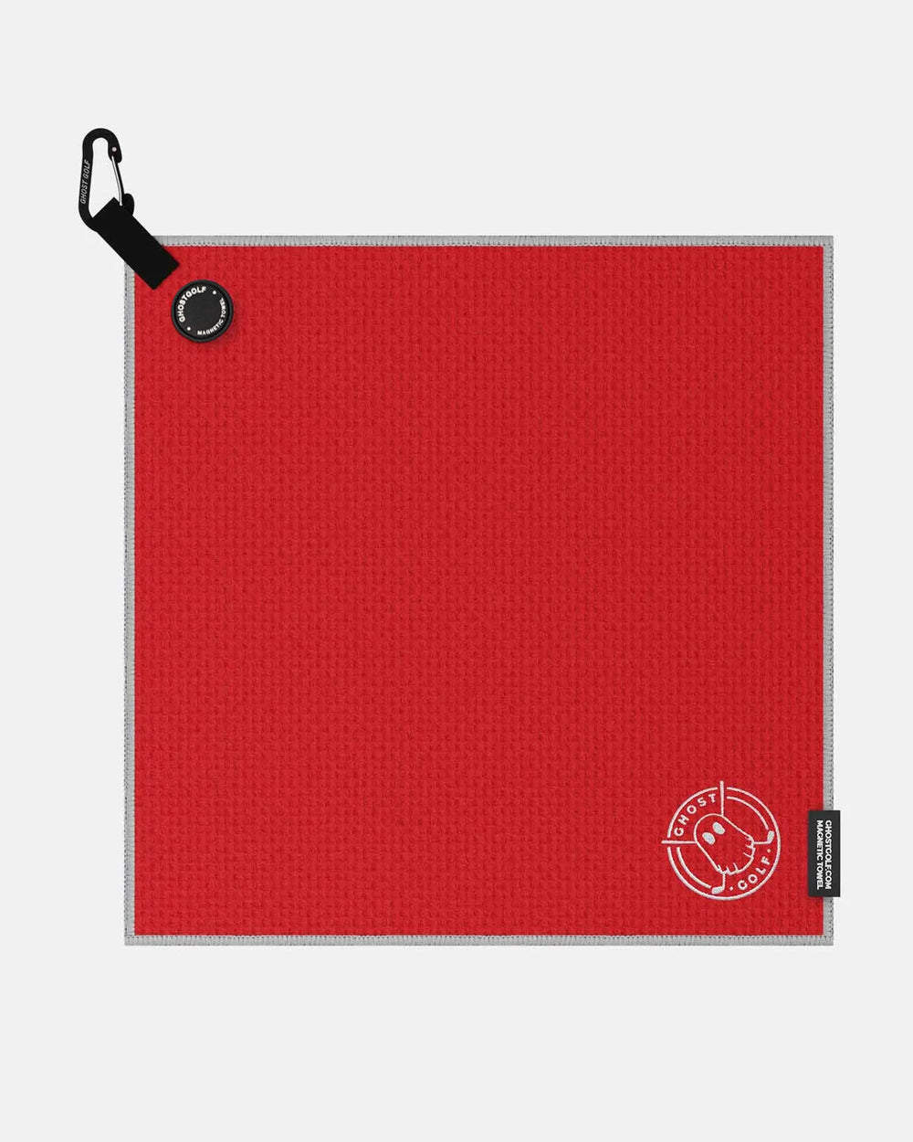 Product shot of Red Ghost Golf Magnetic Greenside Towel with emblem logo near the bottom and carabiner clip at the top #color_red