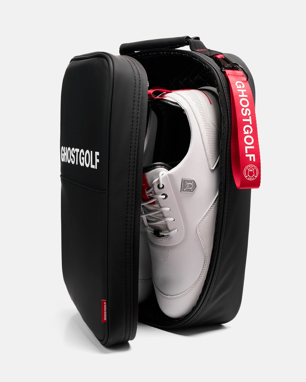 Front product image of the Katana Ghost Golf Shoe Bag opened to reveal a pair of golf shoes inside, showcasing the bag's spacious shoe compartment and carrying design.