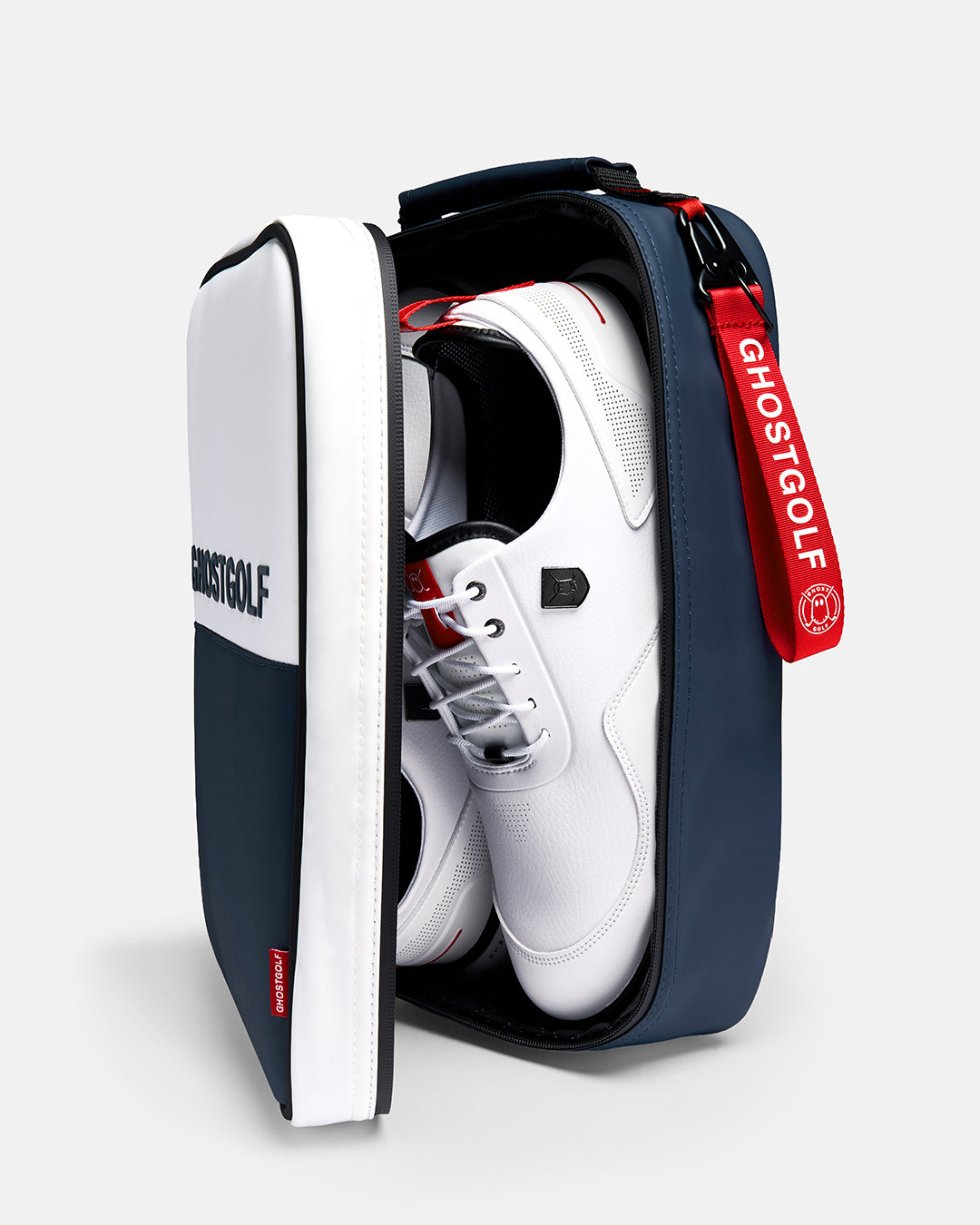 Side Shot of Valor Ghost Golf Shoe Bag with shoe bag pend and showcasing a pair of golf shoes inside #color_valor