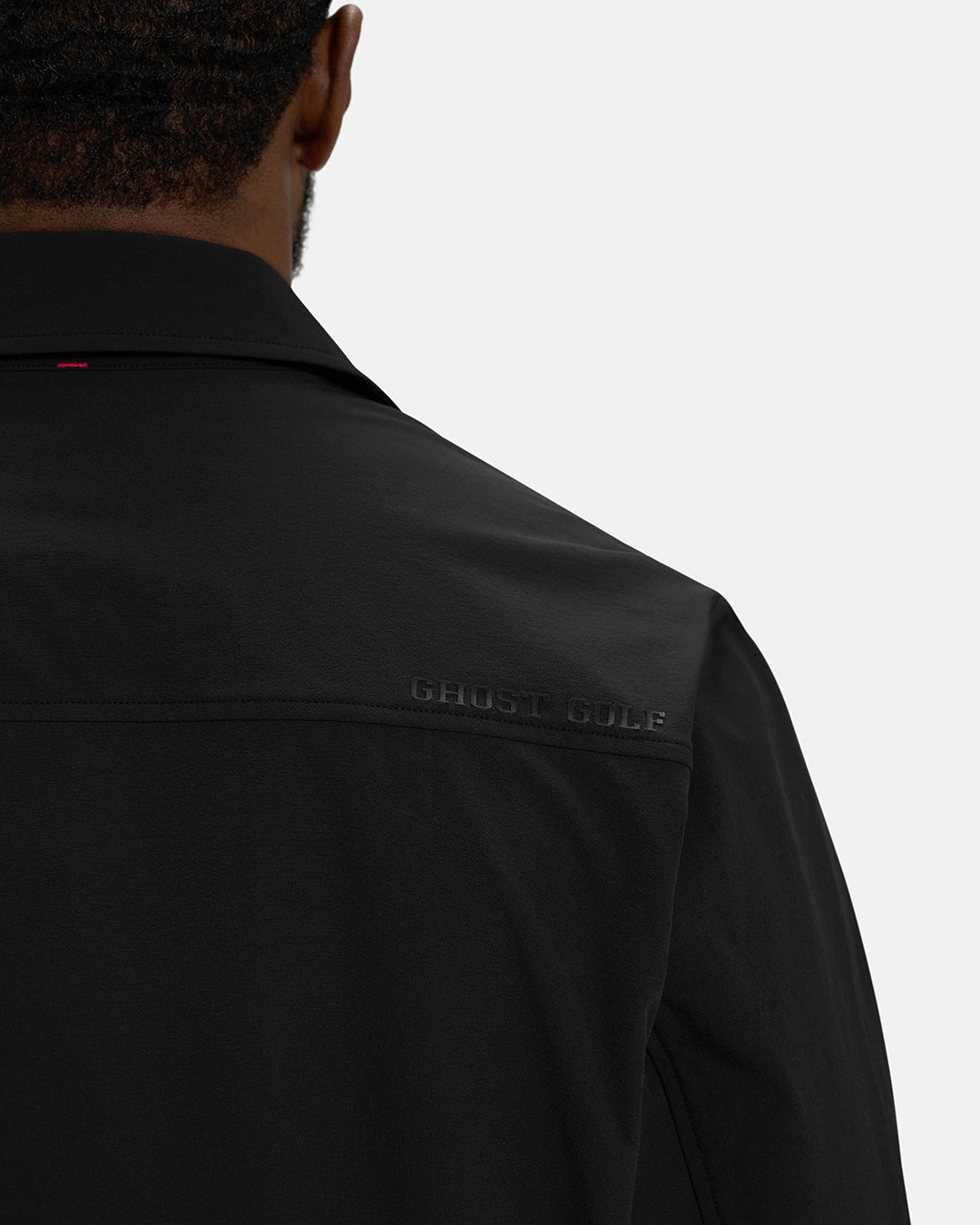 Back Closeup View of Black Spectator Collared Shirt Jacket on Black Male Model with Ghost Golf #color_black