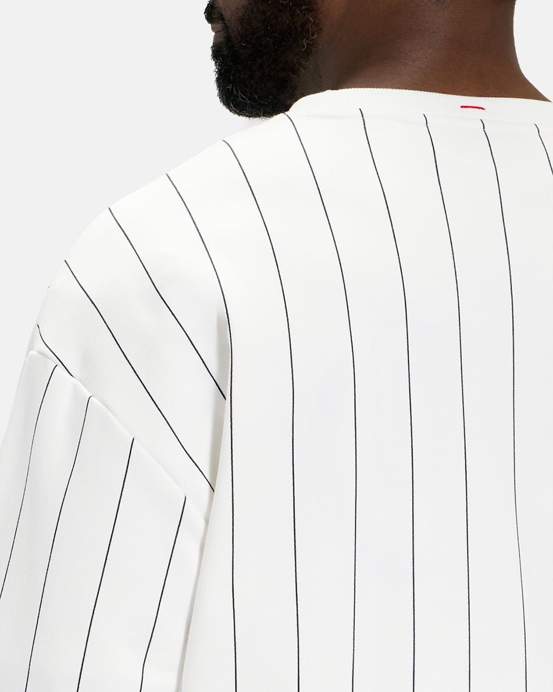 Closeup Back View of White Spectator Crew Sweatshirt on Black Male Modle #color_white