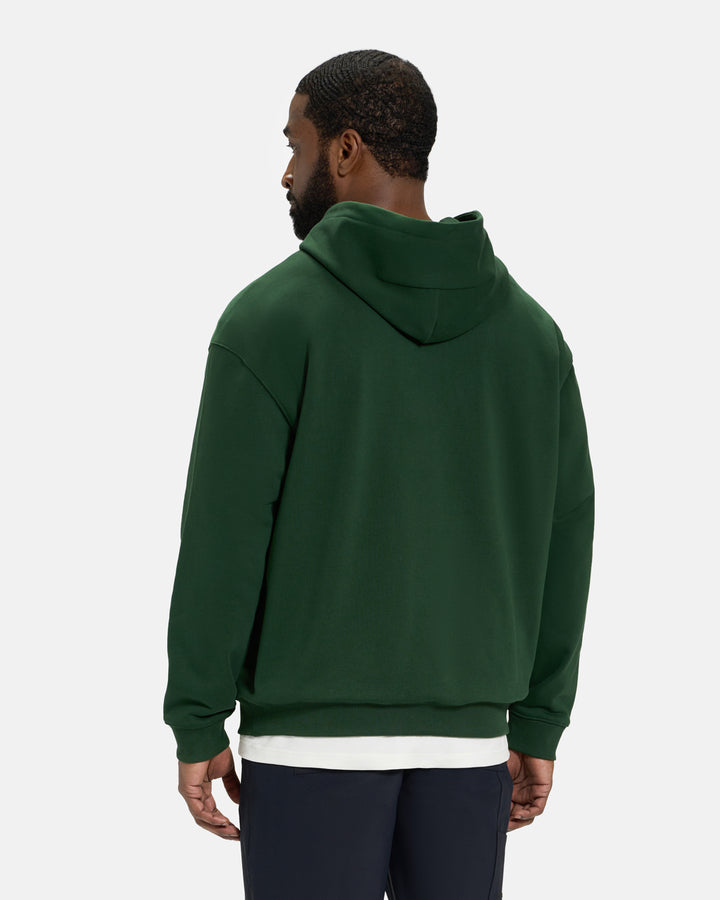 Back View of Bogey Green Spectator Dormie Hoodie on Black Male Model #color_bogey-green