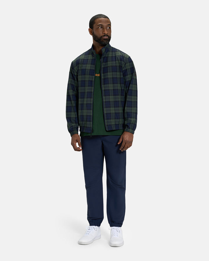 Full Body View of Plaid Dark Navy Spectator Reversible Jacket on Black Male Model wearing forest green tee navy joggers and white shoes #color_plaid-navy
