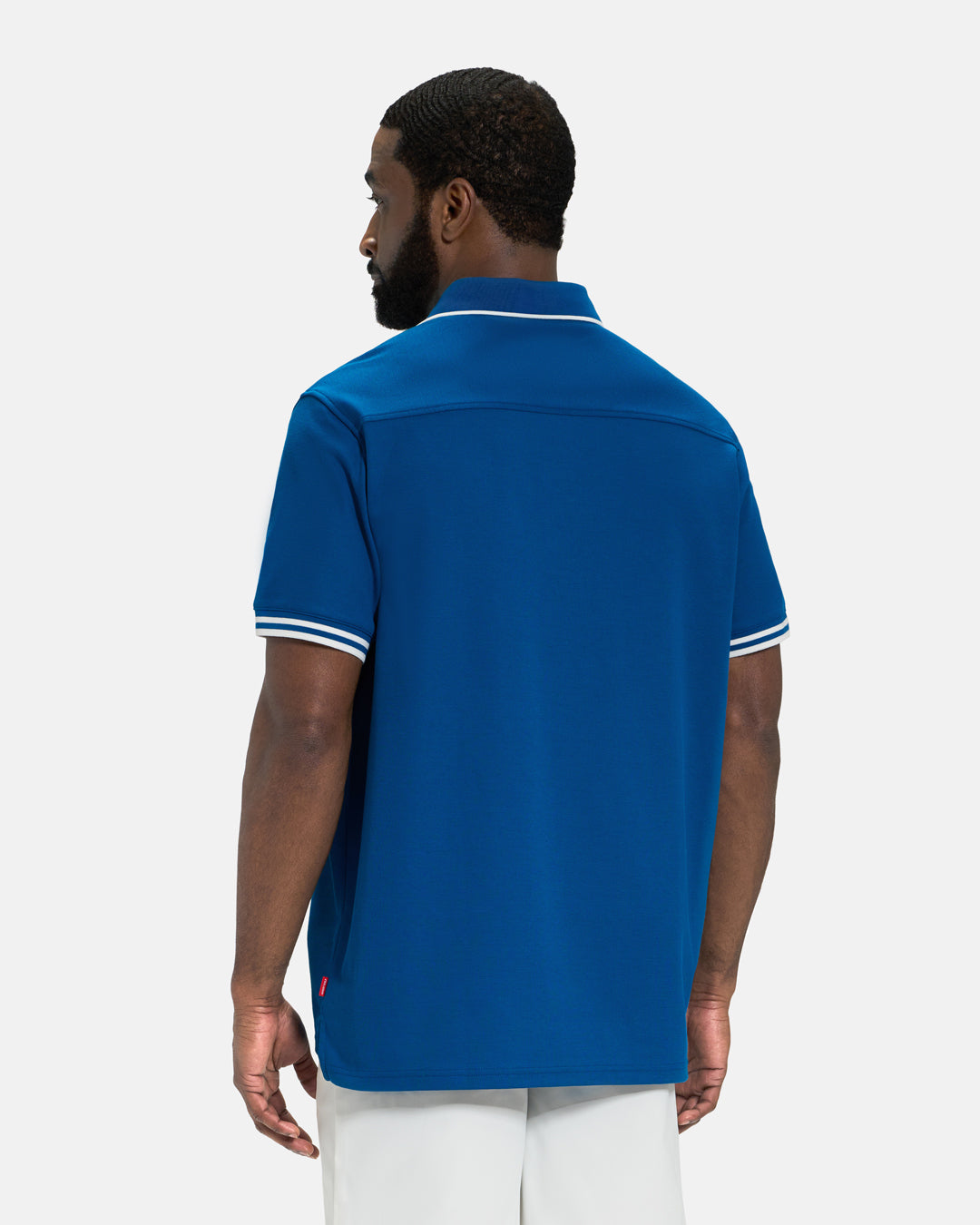 Back View of Royal Blue Spectator Tipped Collar Polo on Black Male Model #color_royal-blue
