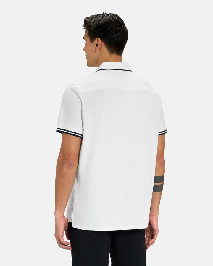 Back View of White Spectator Tipped Collar Polo on Asian Male Model #color_white