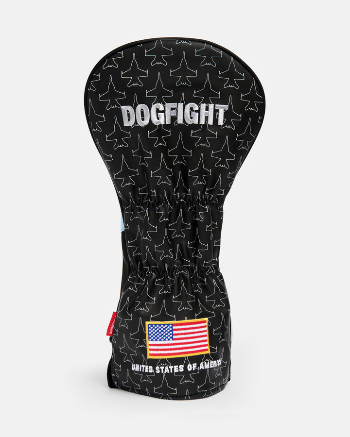 Back product shot of the Striker Secondary Driver Head Cover showcasing an all-over fighter jet icon pattern. Features "Dogfight" embroidery at the top and an embroidered USA flag at the bottom with "United States of America" text beneath it. Rear-facing view highlighting the aviation-inspired graphics, premium embroidery, and patriotic Ghost Golf design details. #size_driver