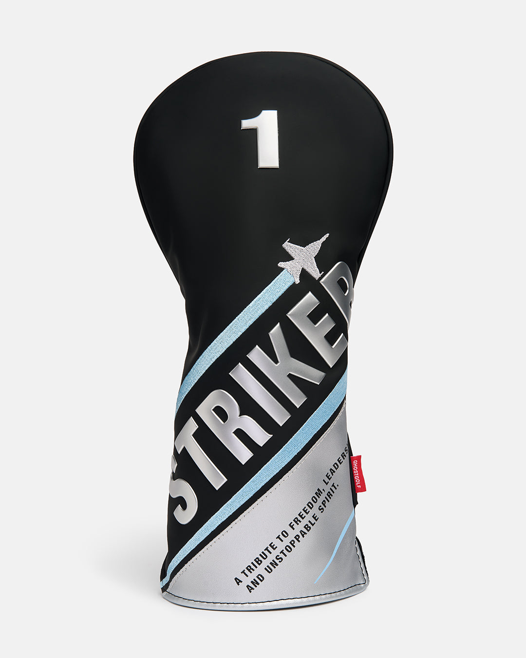 Front product shot of the Striker Tertiary Driver Head Cover featuring oversized Striker typography across the front, with a fighter jet graphic wrapping around the cover. The design also includes a small tribute text detail, showcasing aviation-inspired artwork, premium embroidery. #size_driver