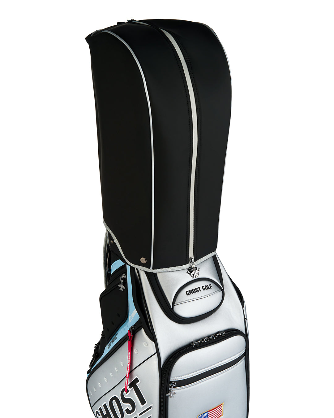 Three-quarter view of the Rain Hood attached to the Striker Staff Bag, showcasing the protective cover design and premium construction.