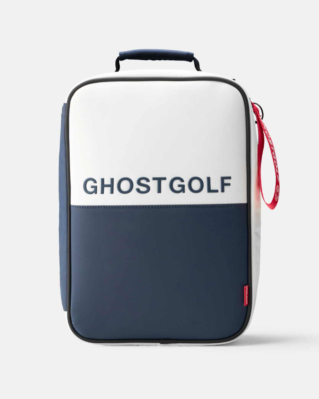 A Ghostgolf shoe bag in a color-blocked white and navy design, featuring the brand name 'GHOSTGOLF' printed in navy on the white upper section. The bag has a top handle, a red zipper pull, and is photographed on a clean, light gray background.