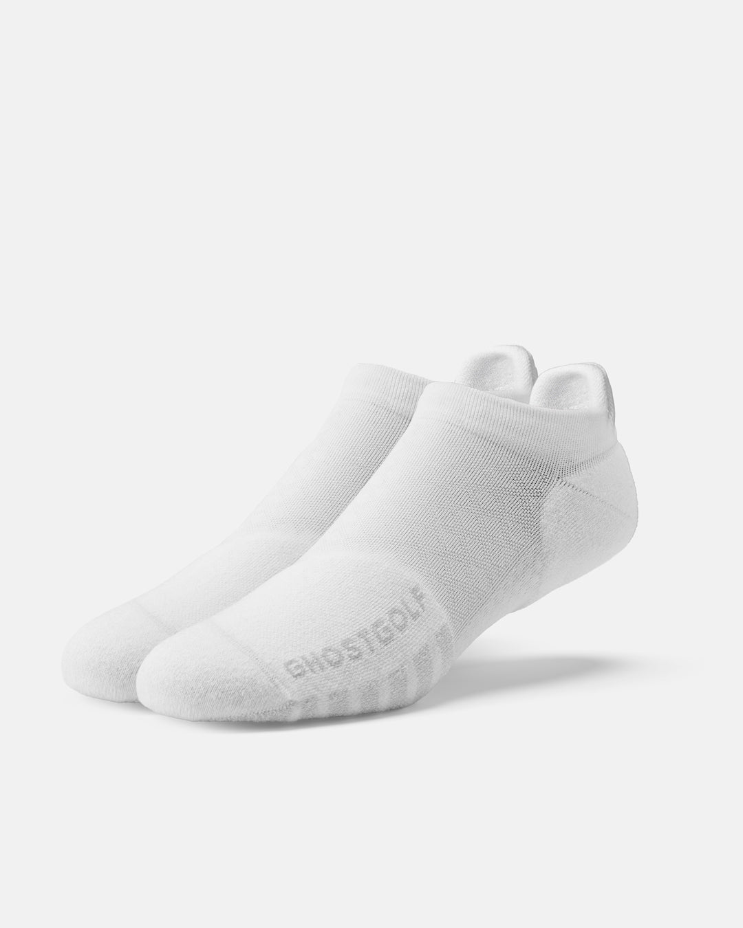 Front product shot of white ankle socks, with one sock featuring ghost golf #color_white