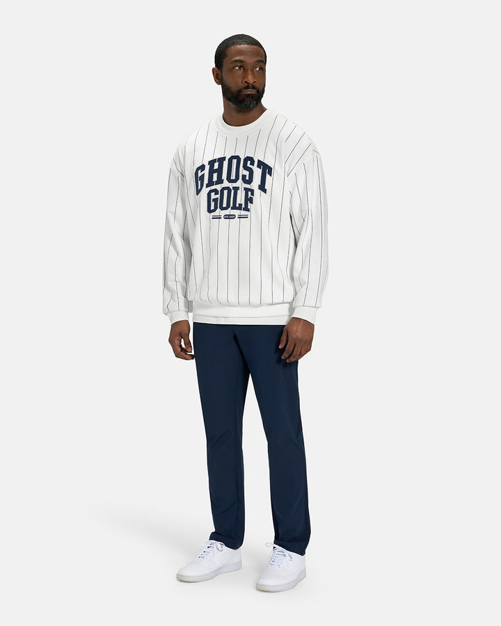 Full Body View of White Spectator Crew Sweatshirt on Black Male Model wearing navy pants and white shoes #color_white